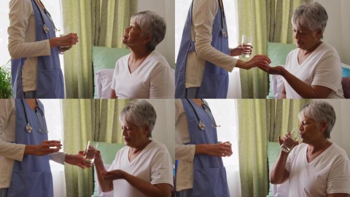 在养老院帮助一位老年妇女的护士