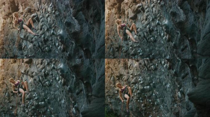 女人在岩壁上垂降外国女人极限运动爬山运动