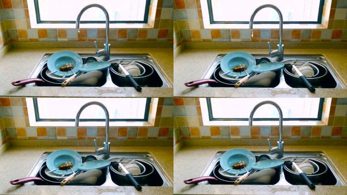 水槽里的脏盘子水槽里的脏盘子洗盘子细菌