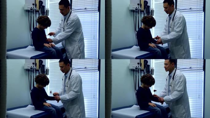 年轻的亚洲男医生在诊所检查高加索男孩病人手的侧视图4k