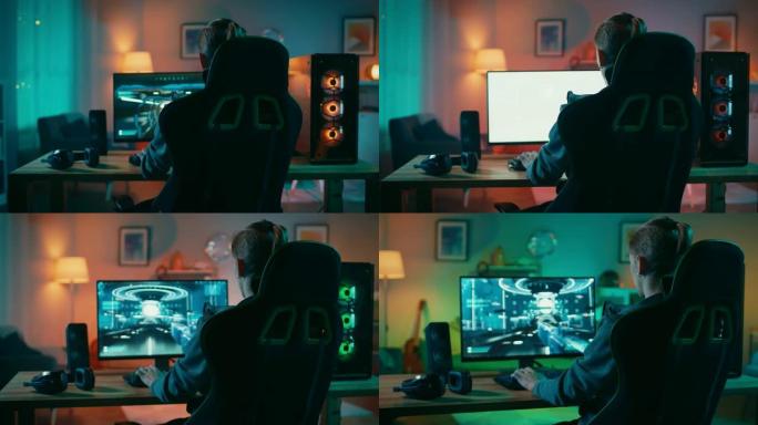 玩家在其功能强大的个人计算机上玩第一人称射击游戏在线视频游戏的背面照片。房间和电脑有彩色霓虹灯。在家