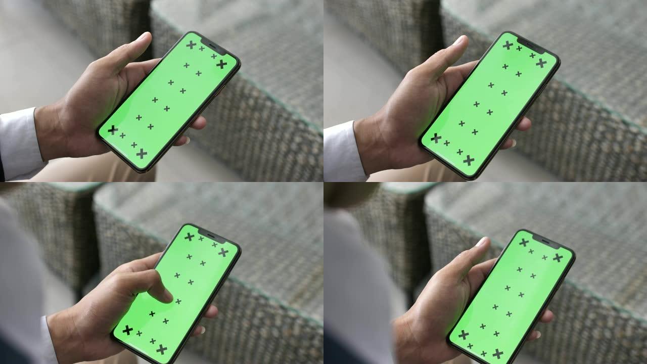 男子使用绿屏智能手机