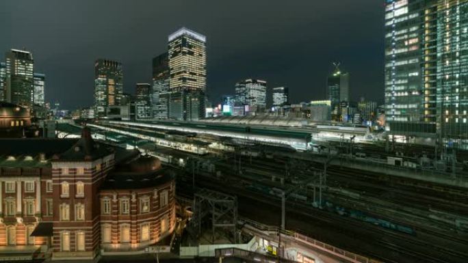 日本东京市黄昏时分，东京站和丸之内的4k延时鸟瞰图列车运输，具有各种建筑城市景观和交通铁路。交通概念