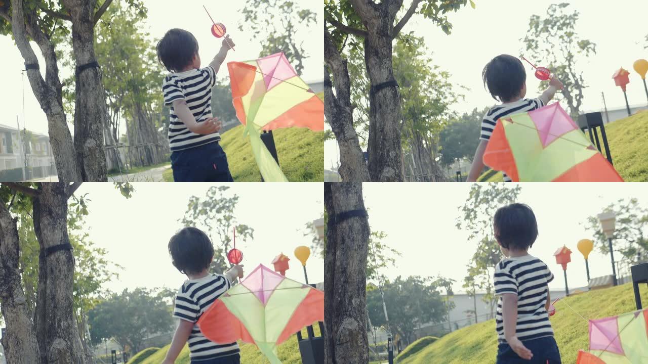 放风筝的亚洲男婴。他年轻时的快乐回忆