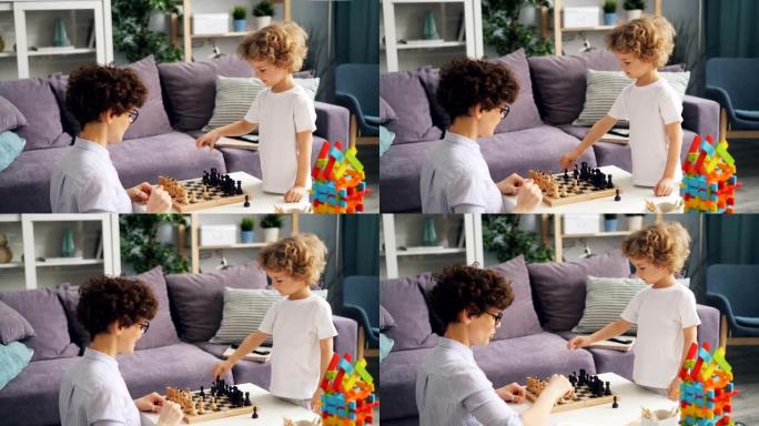 小男孩和他的母亲在家下棋，谈论游戏