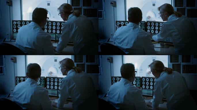 在控制室医生和放射科医生讨论诊断，同时观看程序和监视器显示脑部扫描结果，在背景患者接受MRI或ct扫