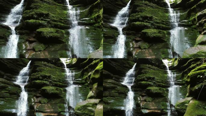 长满苔藓的岩石在山上的瀑布