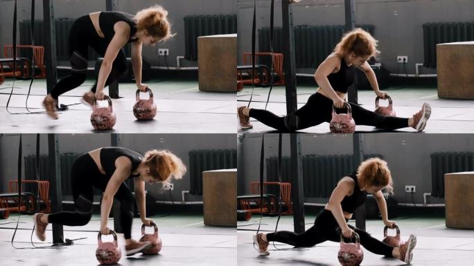 年轻的专业运动健身教练女子在健身房壶铃慢动作上做腿部分体伸展运动。