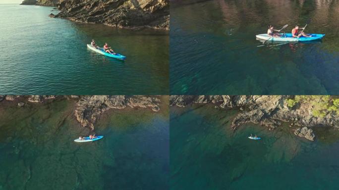 一对夫妇在地中海沿岸划独木舟的航拍视频