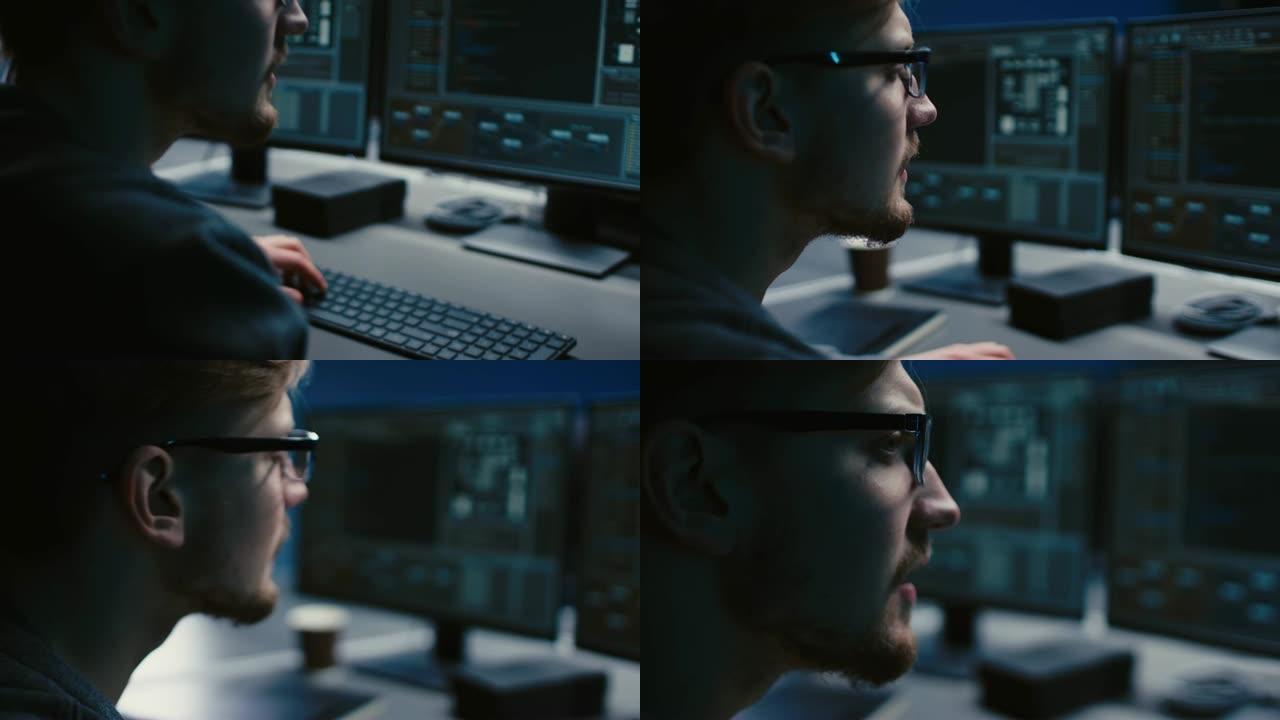 戴着眼镜的IT专家的肖像在个人计算机上工作，屏幕上显示带有编码语言界面的软件程序。深色。特写移动镜头