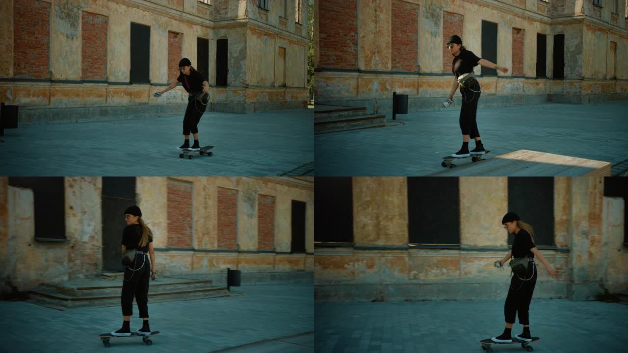 酷酷的年轻女孩戴着豆豆和圆形太阳镜，骑着滑板穿过城市时尚的臀部部分。时髦地区的滑板运动。拍摄后的慢动