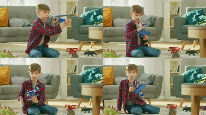 在家: 聪明的小男孩玩玩具飞机。年幼的孩子在阳光明媚的客厅里的地毯上玩耍。慢动作。