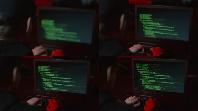 危险的黑客在笔记本电脑键盘上打字