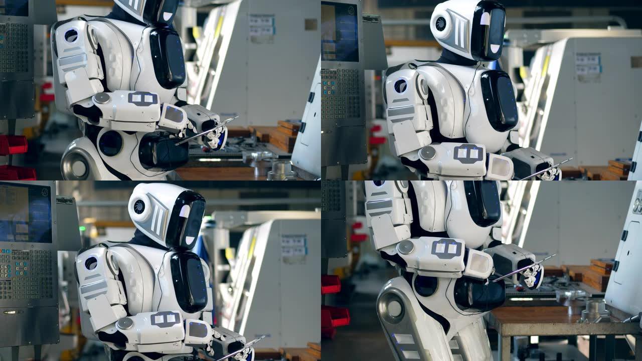 类似人类的droid正在工厂中操作平板电脑