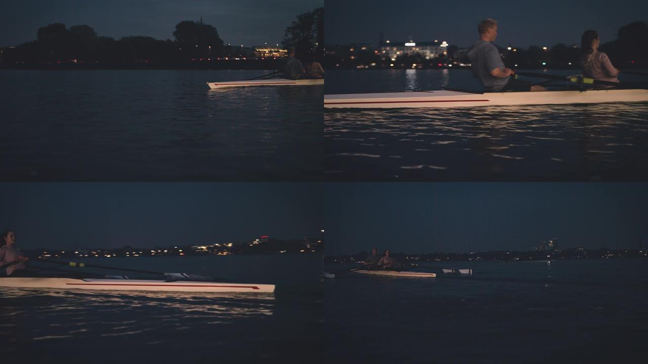 运动员夜间在河里划船