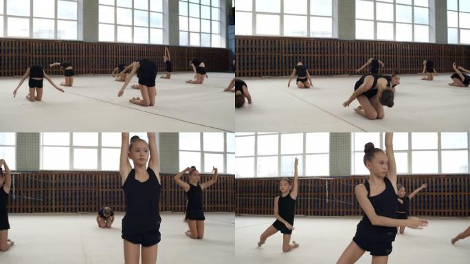 十几岁的女孩练习体操动作