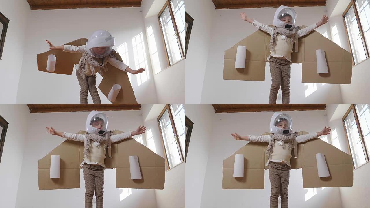 卧室里一个打扮成飞行员或飞行员的女孩假装驾驶纸飞机，并想象自己在天空中自由飞翔。