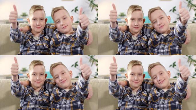 9岁的高加索双胞胎竖起大拇指摆姿势