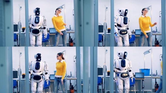 机器人和人际关系。一个半机械人在跳舞时打一个女人，然后她拍打她的脸并离开。4K。