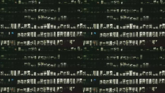 4k外部建立夜间现代办公楼的照片。