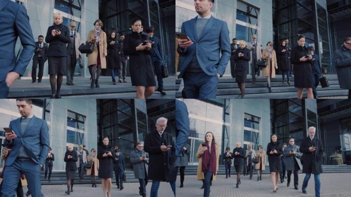 办公室经理和商人正走在现代化的玻璃办公楼前，使用他们的智能手机。人们穿着得体，看起来很成功。他们被他
