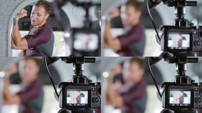 运动员在相机上说话和展示肌肉