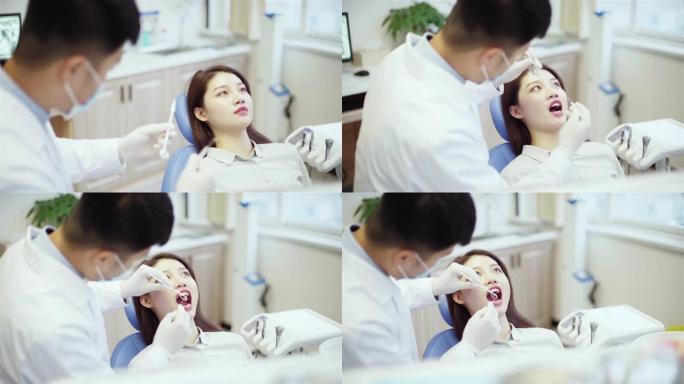 牙医在牙科诊所检查病人