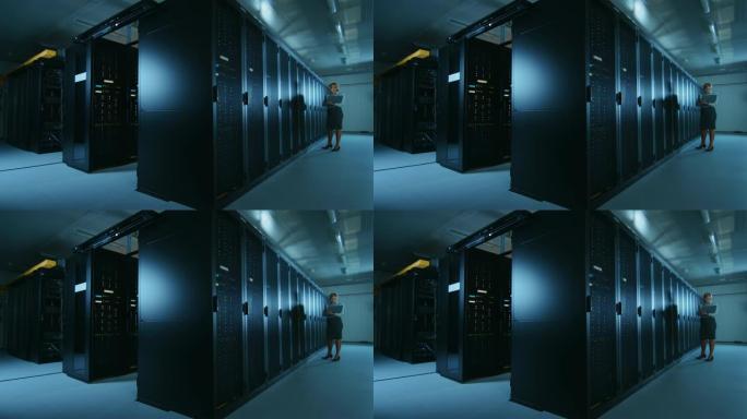 在数据中心，女性IT专家沿着一排操作服务器机架行走，检查正常运行。现代高科技电信运营数据中心。