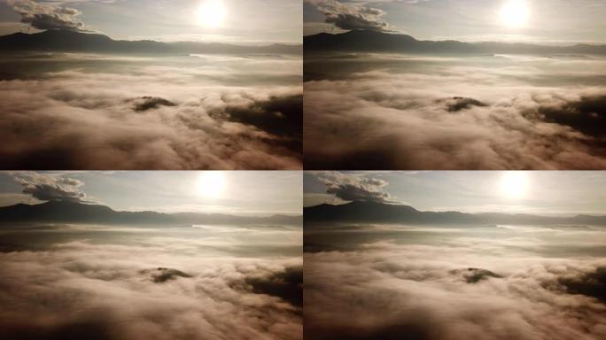 云层上方的山和日出鸟瞰图