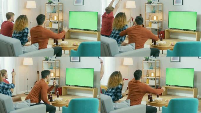 三个体育迷坐在客厅的沙发上观看绿色色度键屏幕电视重要比赛，使用喇叭，为他们的球队加油打气。