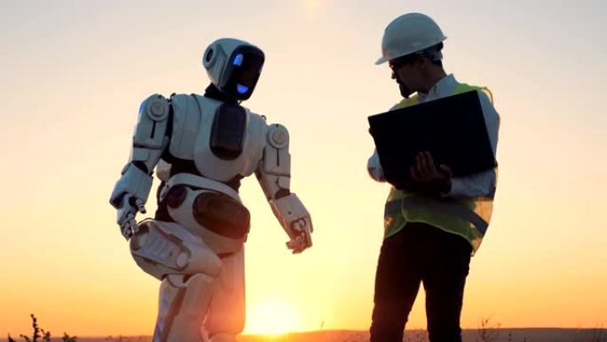 日落背景上的工程师和机器人，特写。