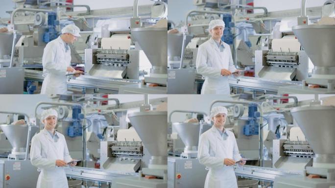 年轻的男性质量主管或食品技术员正在饺子食品工厂检查自动化生产。员工使用平板电脑工作。他看着镜头微笑。