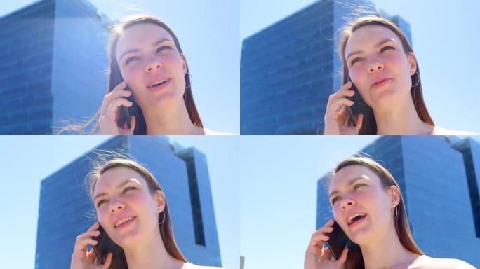 年轻白人女商人在办公室阳台4k手机上聊天的低角度视角