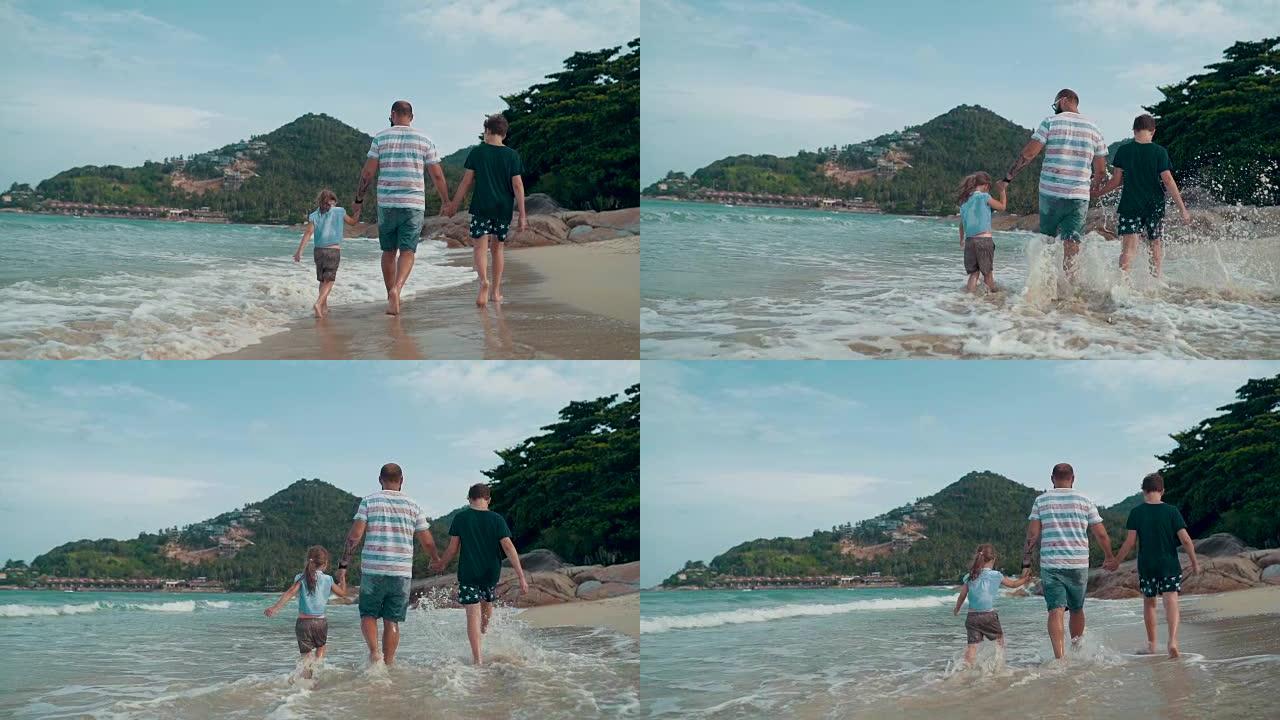 有孩子的父亲喜欢在沙滩上散步