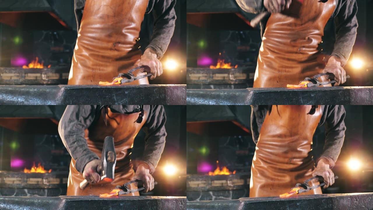 铁匠正在锤击铁工具
