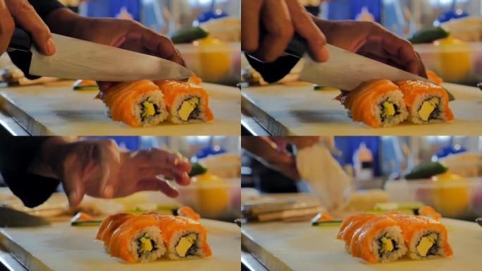 厨师手准备日本食物的特写镜头。厨师在砧板上准备新鲜的寿司，日本厨师在餐厅做寿司。