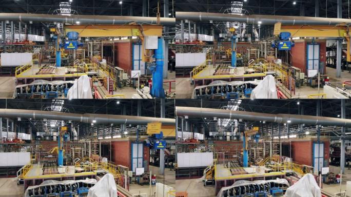 现代工业工厂内部，广角视图。