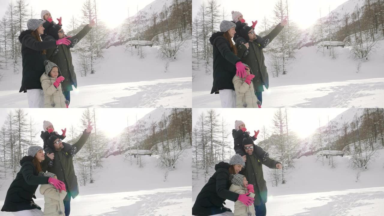 在冬天的日子里，山里的一家人在雪地和大自然中漫步。
