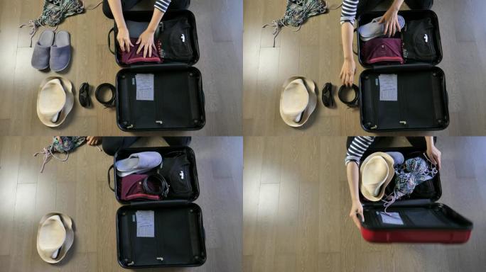 女人为旅行打包行李，准备手提箱概念