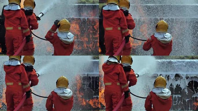 消防员喷洒高压水开火蓝领工人