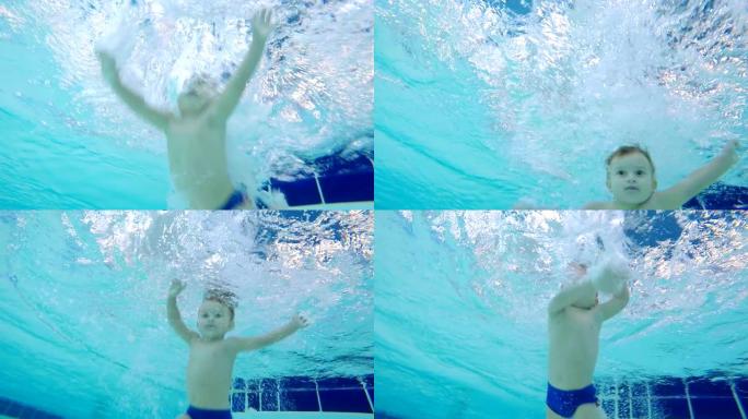 一个小男孩潜入游泳池的水下镜头