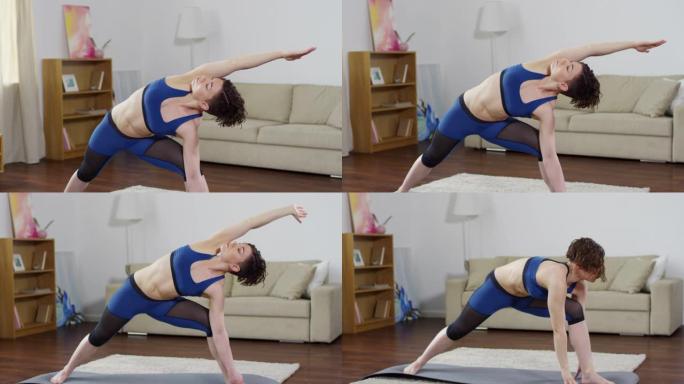 年轻的运动女性在家练习瑜伽
