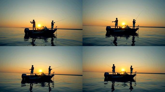 日落背景上的渔民，侧视图。