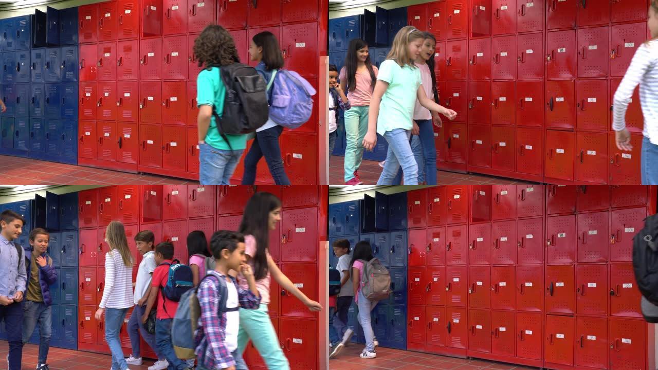 拉丁美洲的中学生一边说话一边微笑着走路去上课