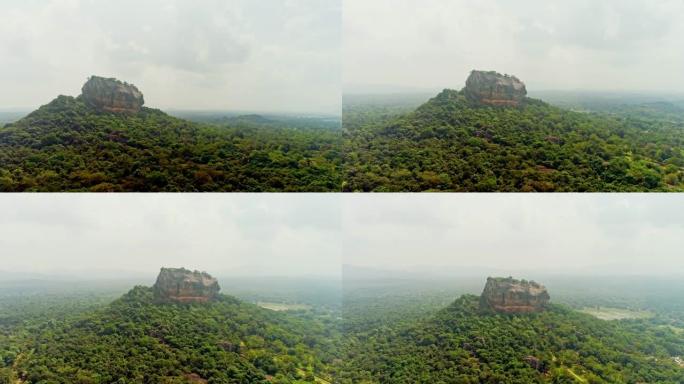 WS崎rock的山顶，周围是郁郁葱葱的绿色景观，斯里兰卡