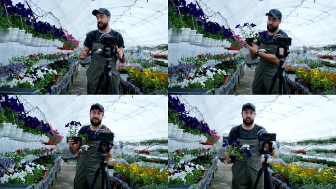 男性园丁向相机展示植物