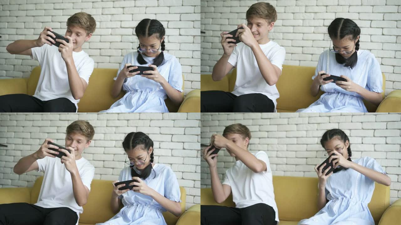 十几岁的男孩和女孩在智能手机上玩视频游戏