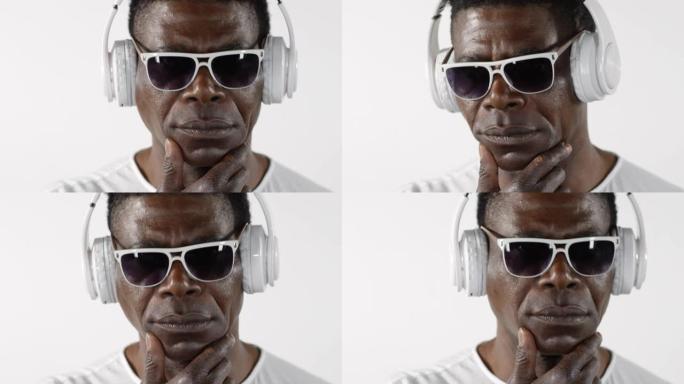 酷酷的非洲裔美国男子戴着耳机听音乐