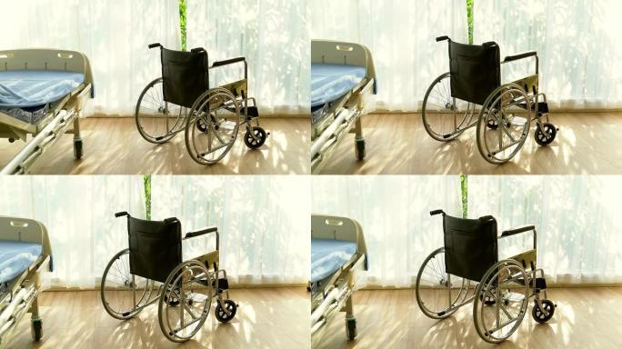在医院的轮椅上，病人坐在轮椅上，他双手放在轮子上，自我照顾病人的行动能力。