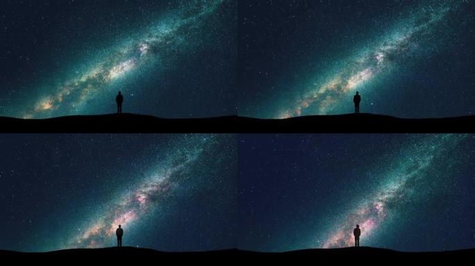 星空背景上的男人剪影。时间流逝